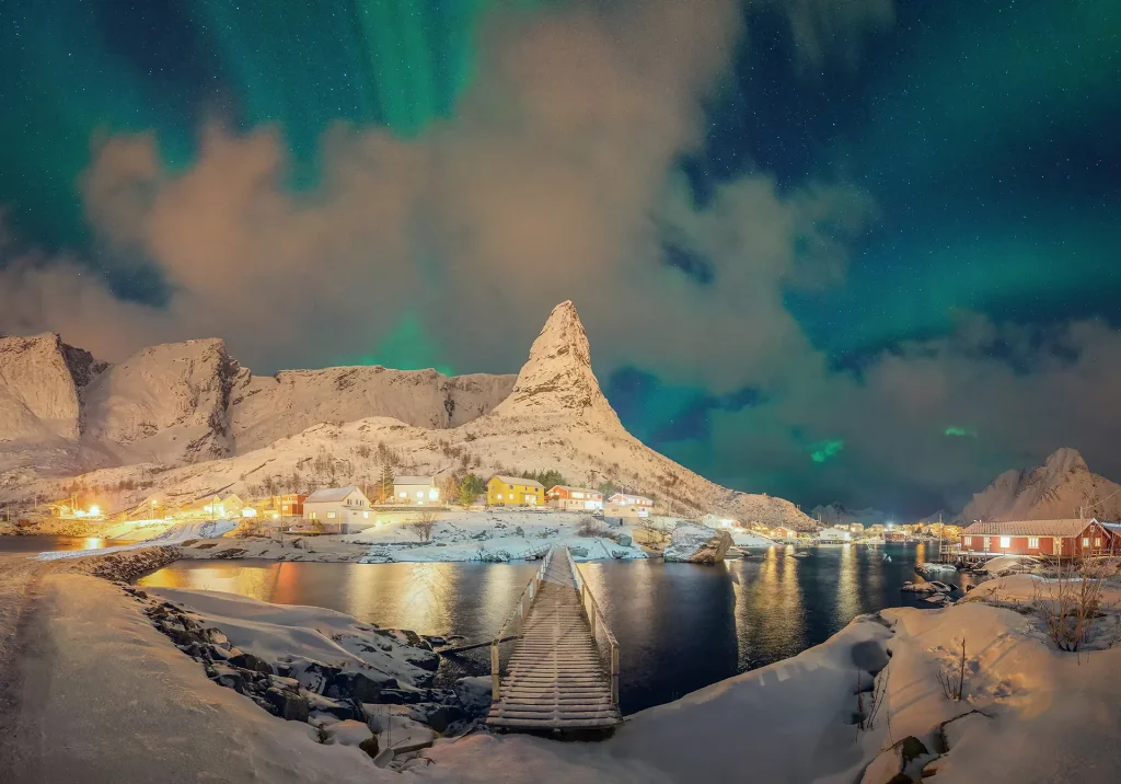 Aurora northern lights and stars in Lofoten island.