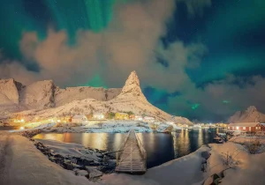 Aurora northern lights and stars in Lofoten island.